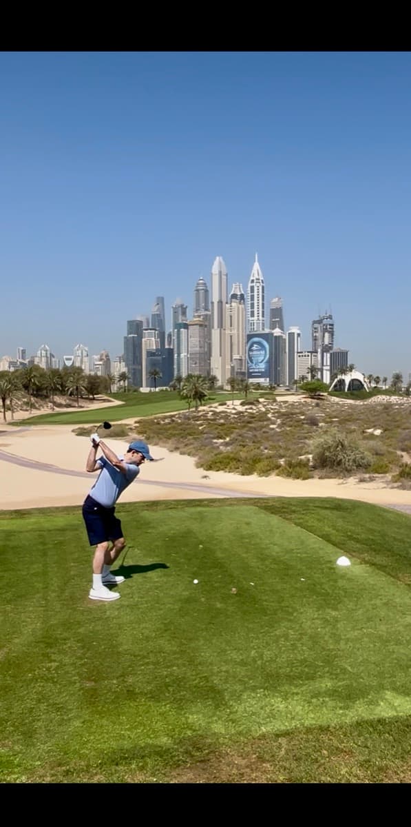 Julian playing golf in Dubai